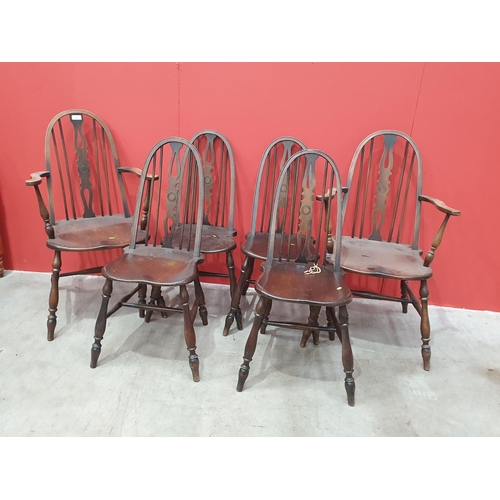 44 - A set of Six dark stained Dining Chairs, two Carvers and four Singles, on turned supports and stretc... 