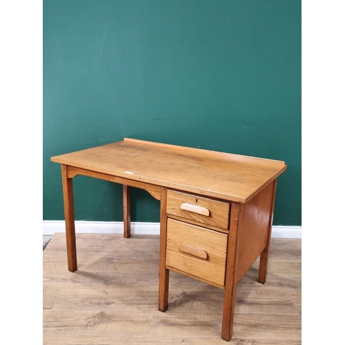 444 - A light oak Desk fitted two drawers, raised on square cut supports, 2ft 7