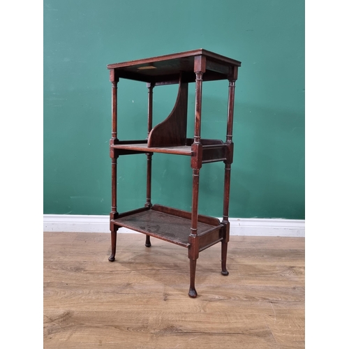 45 - A mahogany three tier Book Stand on turned supports and bun feet, 34