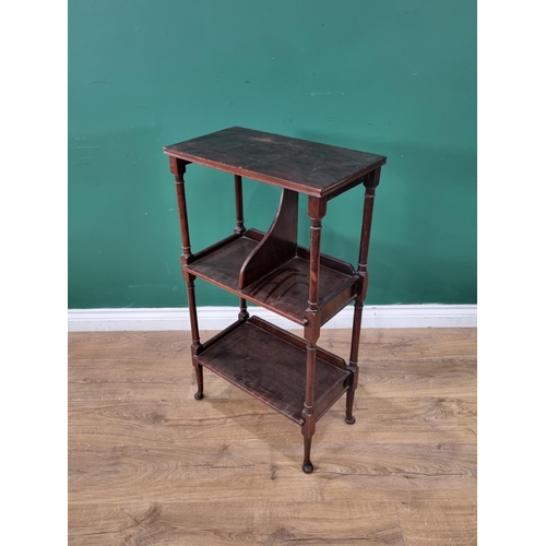 45 - A mahogany three tier Book Stand on turned supports and bun feet, 34