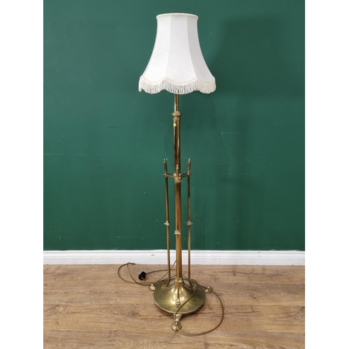 46 - An Art Nouveau Style brass Telescopic Standard Lamp on circular weighted base and pad feet, 6ft 6