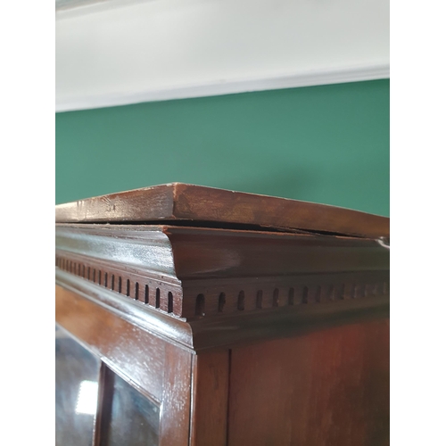 462 - A mahogany Bookcase with pair of astragal glazed doors enclosing adjustable shelves, the base fitted... 