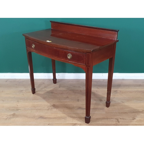 470 - A mahogany bow front Side Table with single fitted drawer, raised gallery back on tapered supports, ... 