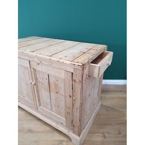 486 - A rustic stripped pine Cupboard with pair of panel doors, one end fitted with single drawer, the oth... 