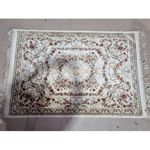 52 - A bordered Persian style Belgian Rug with floral design on a cream ground, 5ft x 2ft 3in (R2)