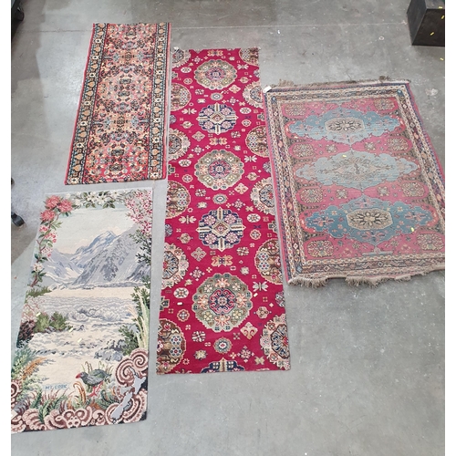 54 - A small Persian Rug with three oval medallions on a pale red ground, 5ft 3in x 3ft 9in two floral Ru... 