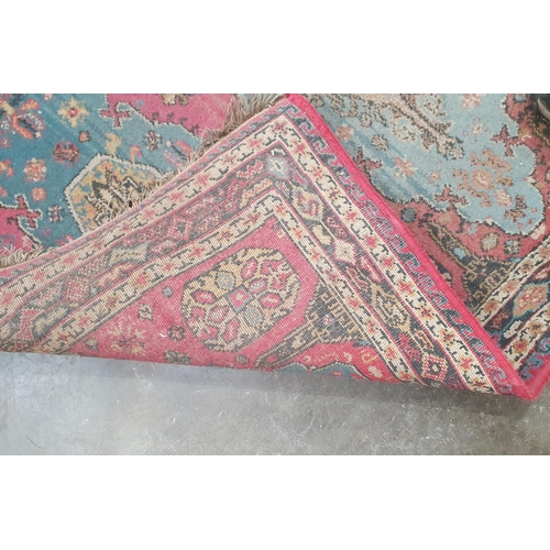 54 - A small Persian Rug with three oval medallions on a pale red ground, 5ft 3in x 3ft 9in two floral Ru... 