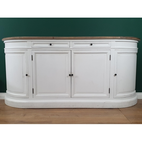 58 - A Modern white painted Sideboard with curved ends, fitted two short drawers above four panelled door... 