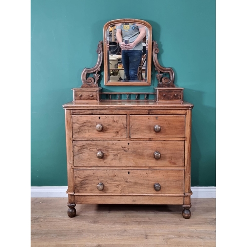 587 - A mahogany Dressing Dressing Chest with arched mirror and two small fitted drawers above two short a... 