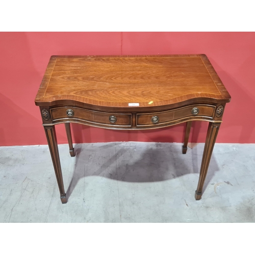 590 - A reproduction mahogany serpentine Side Table fitted two drawers on square tapered supports, 30in H ... 