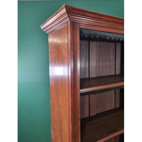 596 - A 19th Century mahogany Open Bookcase the moulded cornice above six adjustable shelves with green an... 