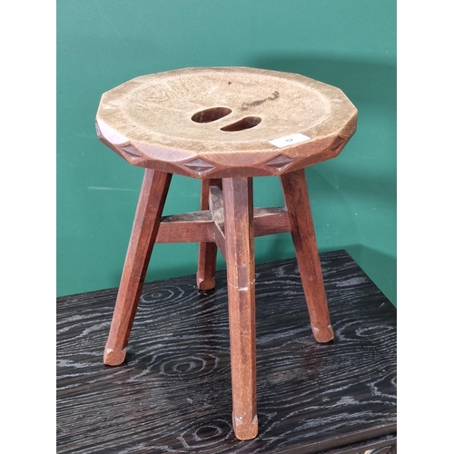 612 - An Arts and Crafts style Stool with pierced, dished seat, carved frieze on chamfered square supports... 