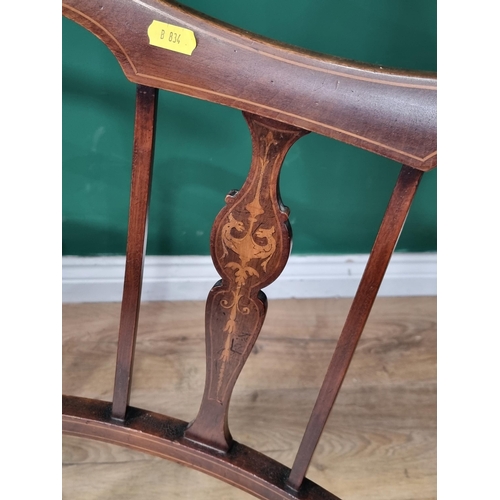 613 - A pair of mahogany Elbow Chairs with satinwood inlay decoration, with cream floral upholstered seats... 