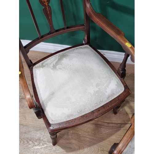 613 - A pair of mahogany Elbow Chairs with satinwood inlay decoration, with cream floral upholstered seats... 