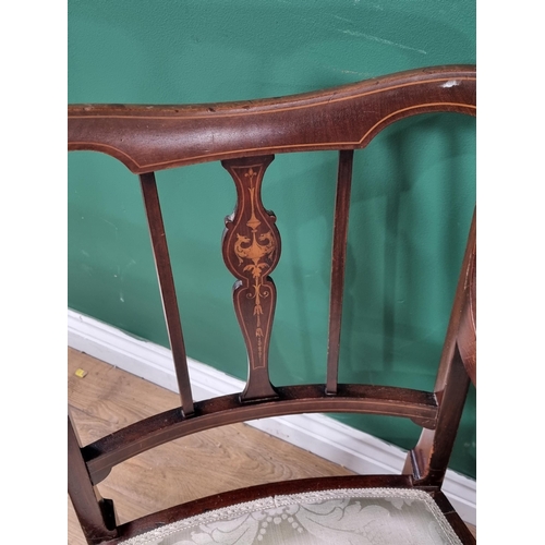 613 - A pair of mahogany Elbow Chairs with satinwood inlay decoration, with cream floral upholstered seats... 