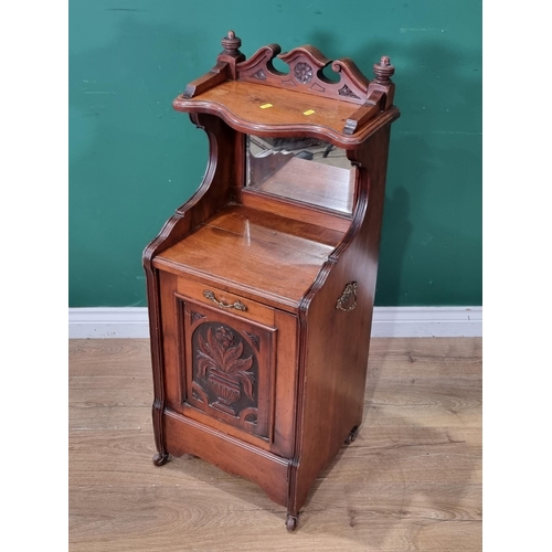 618 - A walnut Coal Purdonium with carved decorative door and raised mirror back, 3ft 2in H x 1ft 5in W