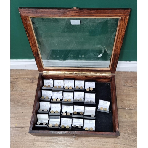 631 - A glazed Display Case containing assorted sets of Coin Cufflinks. (R7).