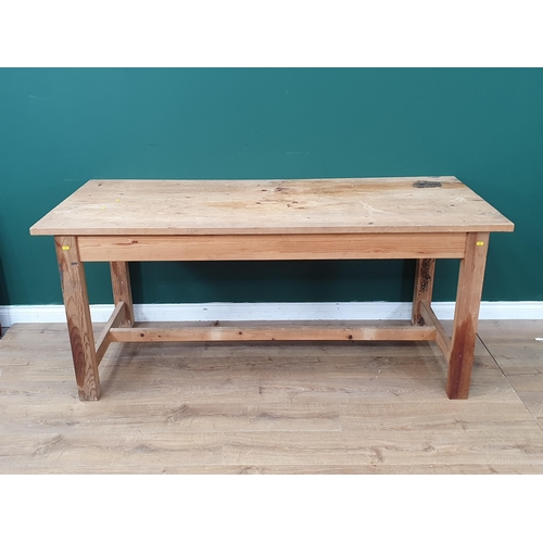 654 - A pine Kitchen Table on square supports united by H stretcher, 2ft 7