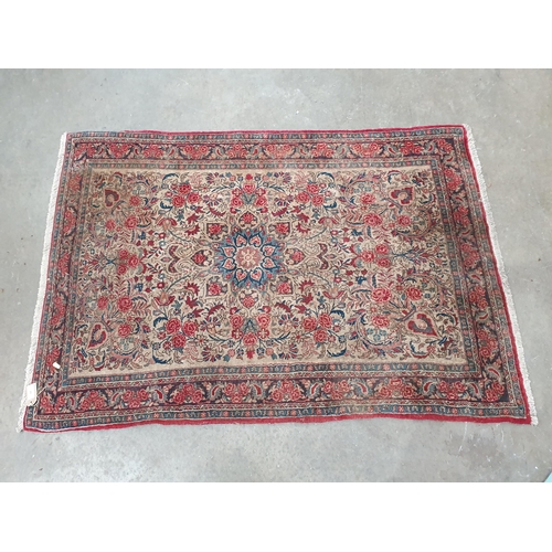 66 - A small Persian style Rug with multi-bordered design and floral designs on a beige ground, 5ft 2in x... 