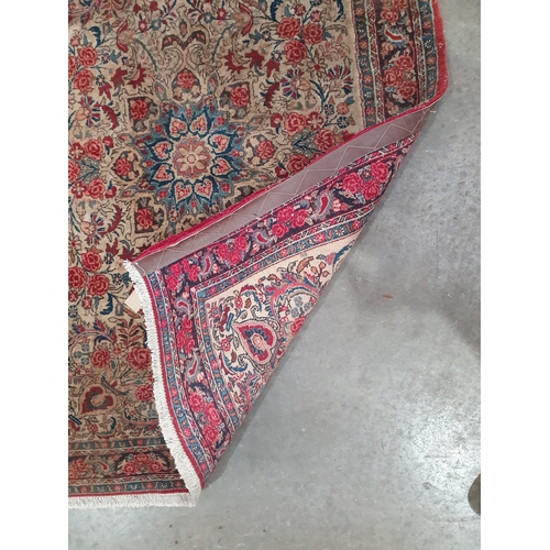 66 - A small Persian style Rug with multi-bordered design and floral designs on a beige ground, 5ft 2in x... 