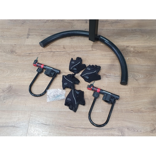 674 - A black floor standing Bike Rack, two Bikemate Bicycle Locks, and two pairs of Cycling Gloves. (R7).