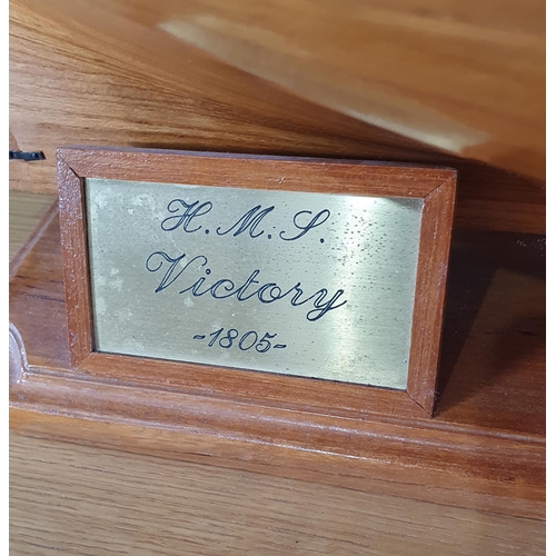 69 - A large wooden Model of H.M.S Victory on stand with rigging and sails, Lifeboats etc, 4ft 10in L app... 