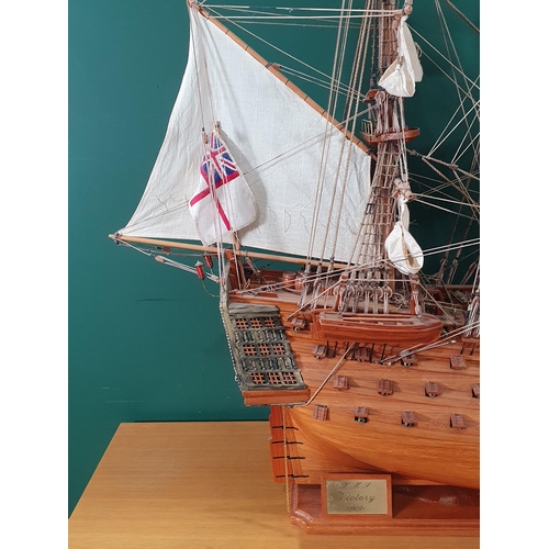 69 - A large wooden Model of H.M.S Victory on stand with rigging and sails, Lifeboats etc, 4ft 10in L app... 