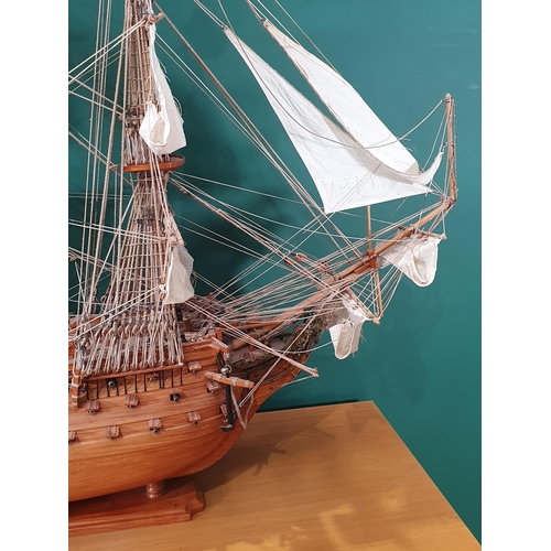 69 - A large wooden Model of H.M.S Victory on stand with rigging and sails, Lifeboats etc, 4ft 10in L app... 