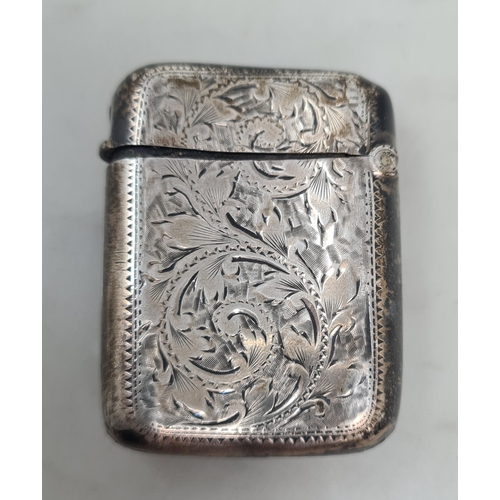 694 - An antique silver Vesta Case with engraved floral design