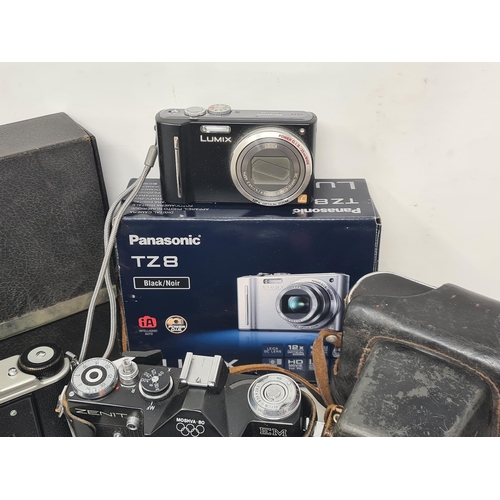 695 - A box of Film and Digital Cameras, Lenses and Photographic Accessories