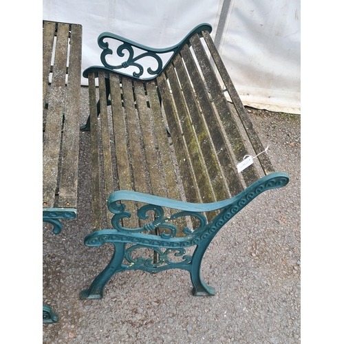 71 - A green painted cast and slatted Garden Set comprising of two-seater Bench, a Table and pair of Chai... 