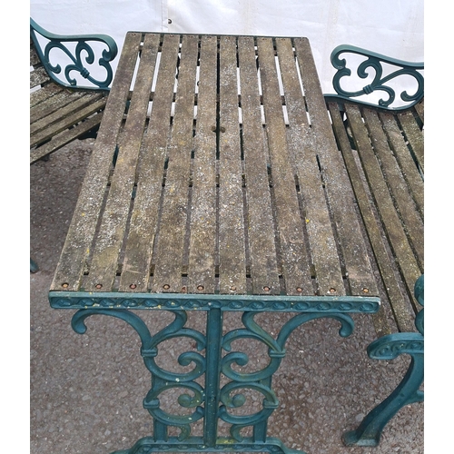 71 - A green painted cast and slatted Garden Set comprising of two-seater Bench, a Table and pair of Chai... 