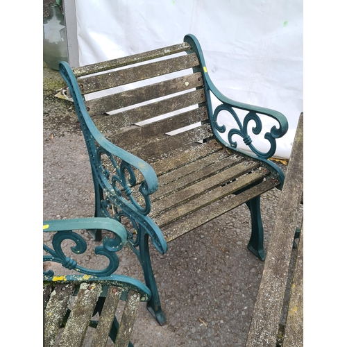 71 - A green painted cast and slatted Garden Set comprising of two-seater Bench, a Table and pair of Chai... 