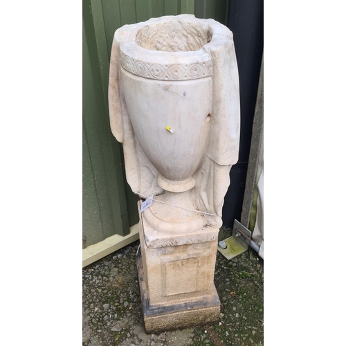 75 - A white marble Urn with carved frieze and drapery on square base stood upon an associated plinth, 3f... 