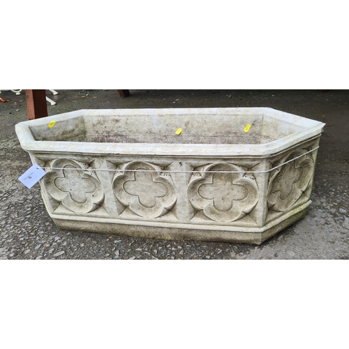 76 - A shaped composite stone Garden Planter with Gothic style designs, 11.5 in H x 2ft 11in L