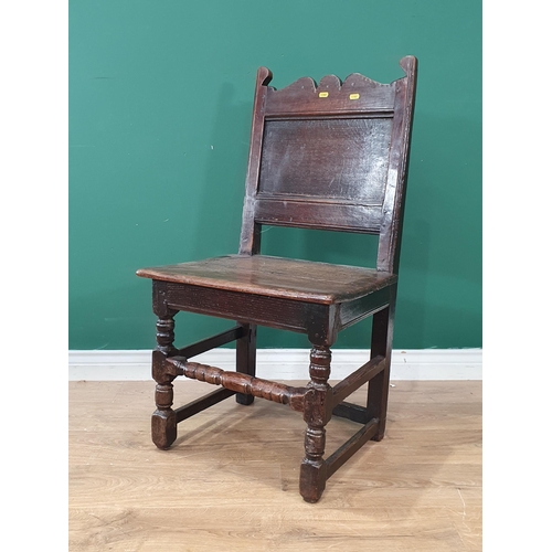 8 - An antique oak Hall Chair with shaped top rail, panel back with solid seat, with turned front suppor... 