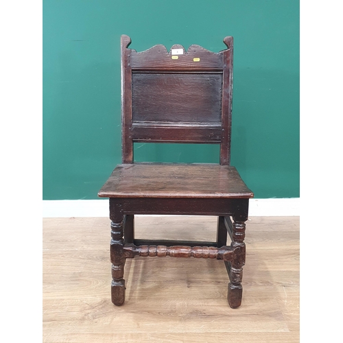 8 - An antique oak Hall Chair with shaped top rail, panel back with solid seat, with turned front suppor... 