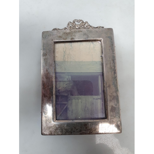 150 - A George V small silver Photograph Frame with ribbon surmount, Birmingham 1910, pair  of Georgian Sa... 