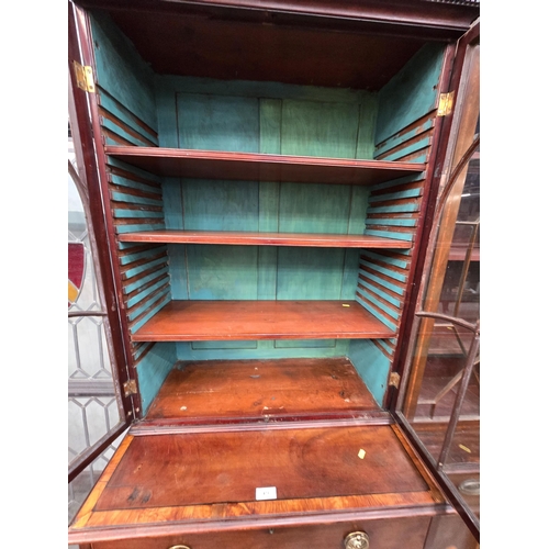 473 - A 19th Century mahogany and satinwood Secretaire Bookcase, the top with pair of astragal glazed door... 