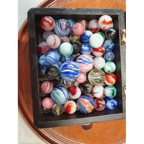 385 - A Solitaire Board and a box containing marbles including some old marbles