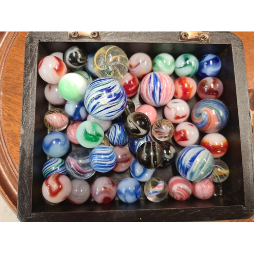 385 - A Solitaire Board and a box containing marbles including some old marbles