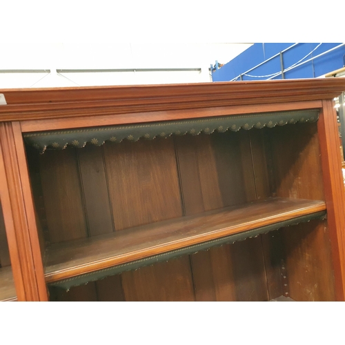 596 - A 19th Century mahogany Open Bookcase the moulded cornice above six adjustable shelves with green an... 