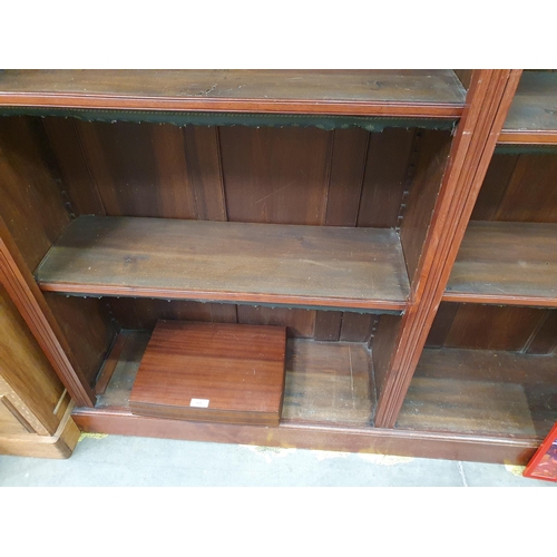 596 - A 19th Century mahogany Open Bookcase the moulded cornice above six adjustable shelves with green an... 