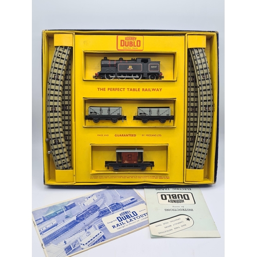 1046 - A boxed Hornby Dublo EDG16 Goods Set, unused with literature. Locomotive in mint condition showing n... 