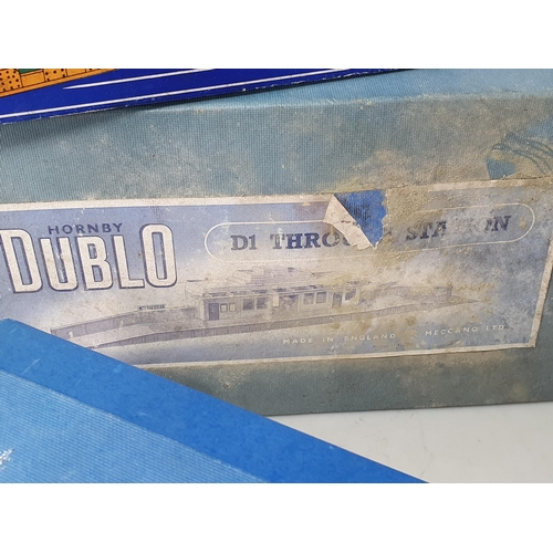 1089 - A boxed Hornby Dublo D1/455 Through Station (box A/F),  a boxed D1 Island Platform, a boxed D1 metal... 