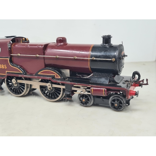 1114 - An unboxed Hornby 0 gauge clockwork 4-4-0 Midland Compound Locomotive and Tender