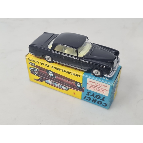 1152 - A boxed Corgi Toys No.230 black Mercedes-Benz 220SE Coupe, Nr M, box Ex plus