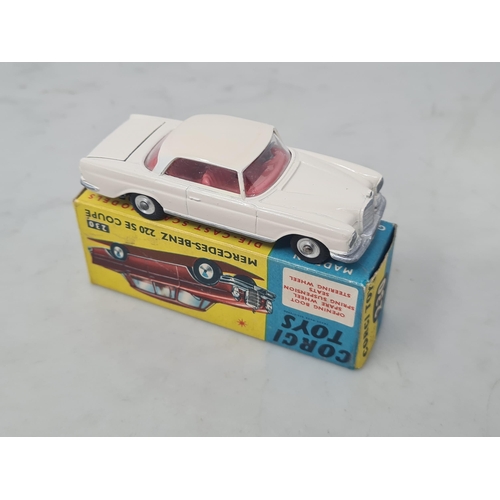 1157 - A boxed Corgi Toys No.230 cream Mercedes-Benz 220SE Coupe, Nr M, box Ex plus