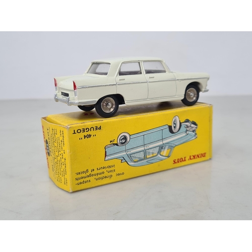 1173 - A boxed French Dinky Toys No.553 cream Peugeot 404, Nr M, box Ex plus