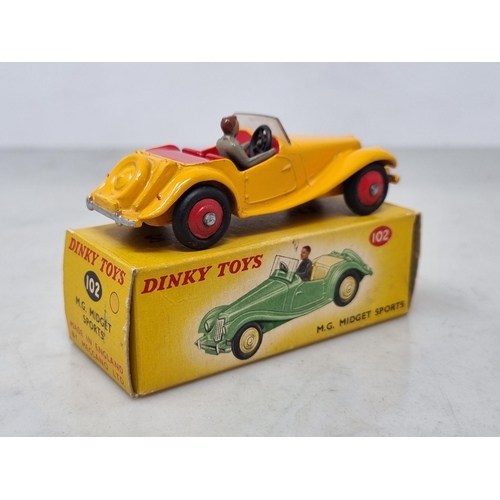 1239 - A boxed Dinky Toys No.102 dark yellow M.G. Midget Sports, Nr M-M, box nr perfect